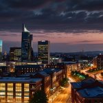 Vibrant Manchester skyline at dusk with modern buildings and glowing lights, reflecting economic growth.