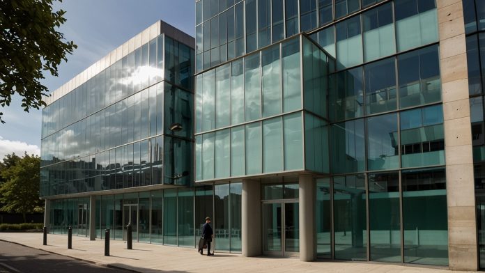 Modern office building with glass facade, representing Kier Group's headquarters in Manchester, UK.