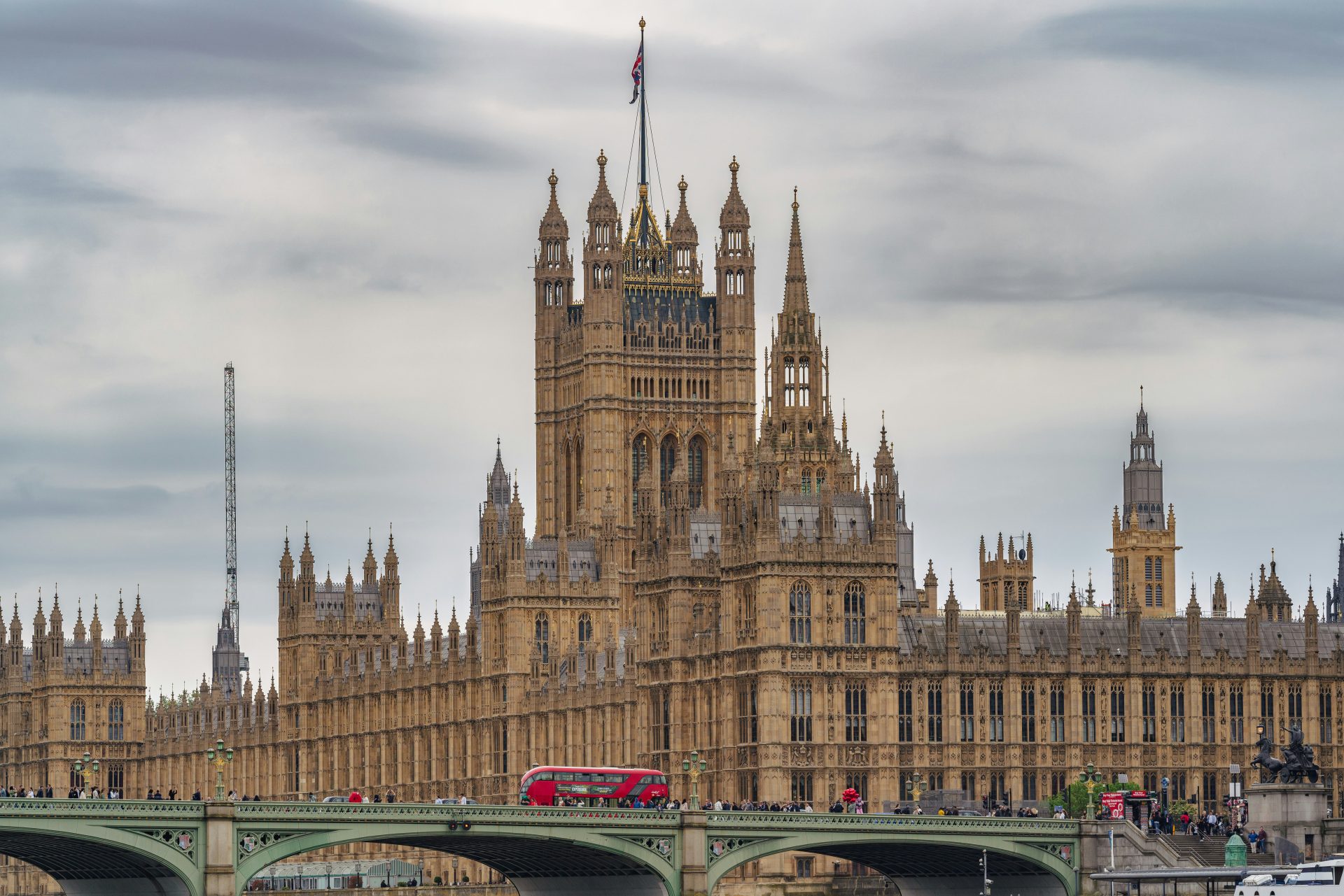 UK Parliament building, symbolizing government oversight on welfare reform and migrant-related public spending.