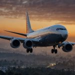 A Boeing 737 MAX jet takes off from a U.S. runway at sunrise, symbolizing the company’s restored FAA certification and renewed growth trajectory.