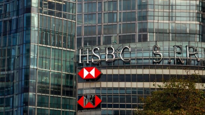 HSBC Shares Hit 8-Year High as FTSE 100 Smashes Records on $42 Billion Income Upgrade HSBC headquarters in Canary Wharf London with FTSE 100 at 9704 record close and HSBA +5.2% stock surge overlay October 29 2025