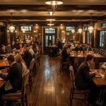 Vibrant UK pub interior filled with patrons enjoying meals and drinks, illustrating Mitchells & Butlers' profit beat and hospitality sector recovery amid economic optimism for 2025