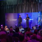 Decentralized Masters founders on stage at the MI Summit