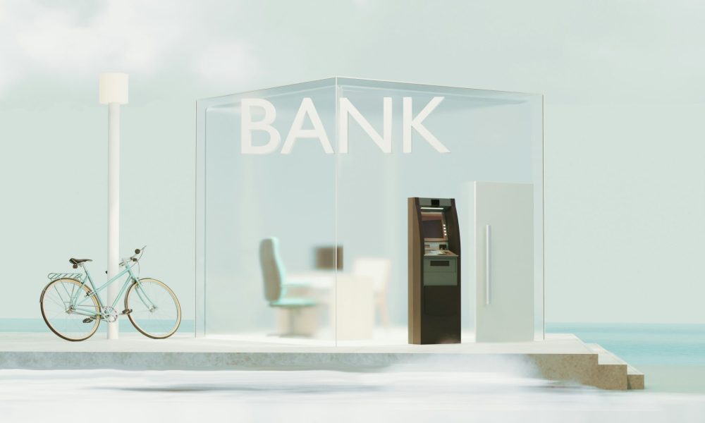 Glass-fronted local bank branch with an ATM