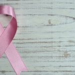 Pink ribbon for breast cancer awareness, symbolising the cancer research funded by Bricoleur Vineyards Sip With Purpose campaign