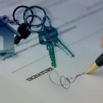 House keys on a signed property agreement