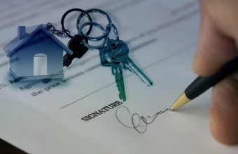 House keys on a signed property agreement