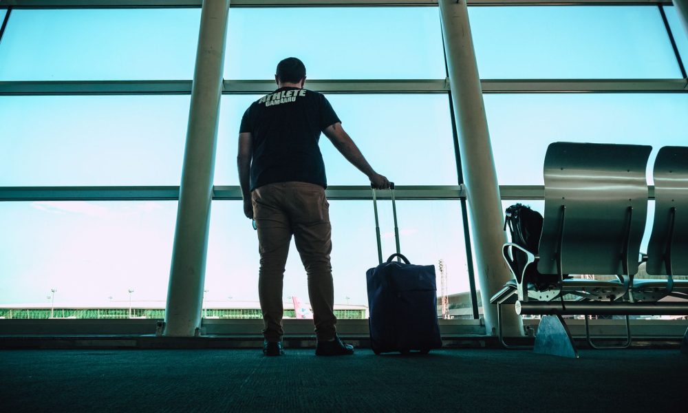 Traveller with luggage at an airport