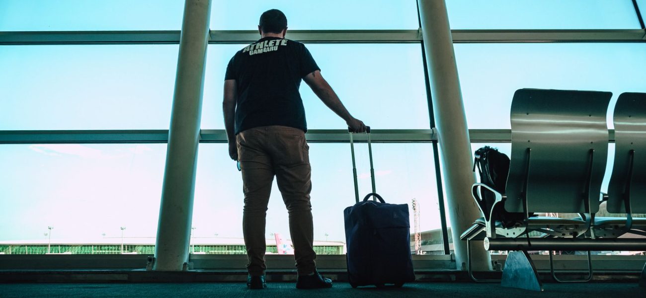 Traveller with luggage at an airport