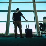 Traveller with luggage at an airport