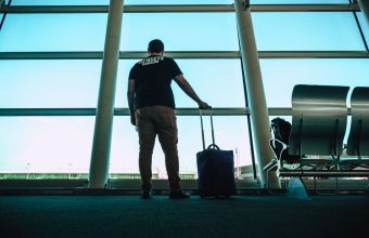 Traveller with luggage at an airport