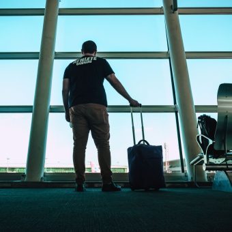 Traveller with luggage at an airport