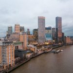 Aerial view of city buildings by the water