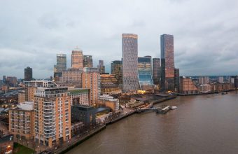 Aerial view of city buildings by the water