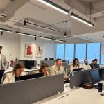 Team working in a modern Dubai office with city views