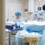 Clinicians at work in an endoscopy suite, where new colonoscopy technologies are being adopted