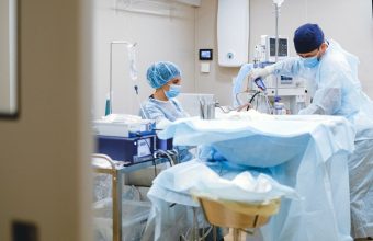 Clinicians at work in an endoscopy suite, where new colonoscopy technologies are being adopted