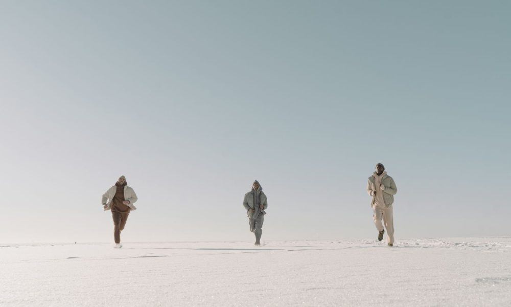 Runners crossing a vast plain of ice and snow, the kind of polar course Great World Race competitors face at Wolf's Fang, Antarctica