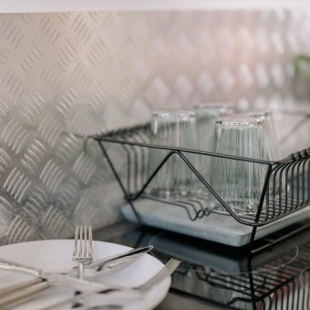 Dish rack with glassware on a kitchen counter