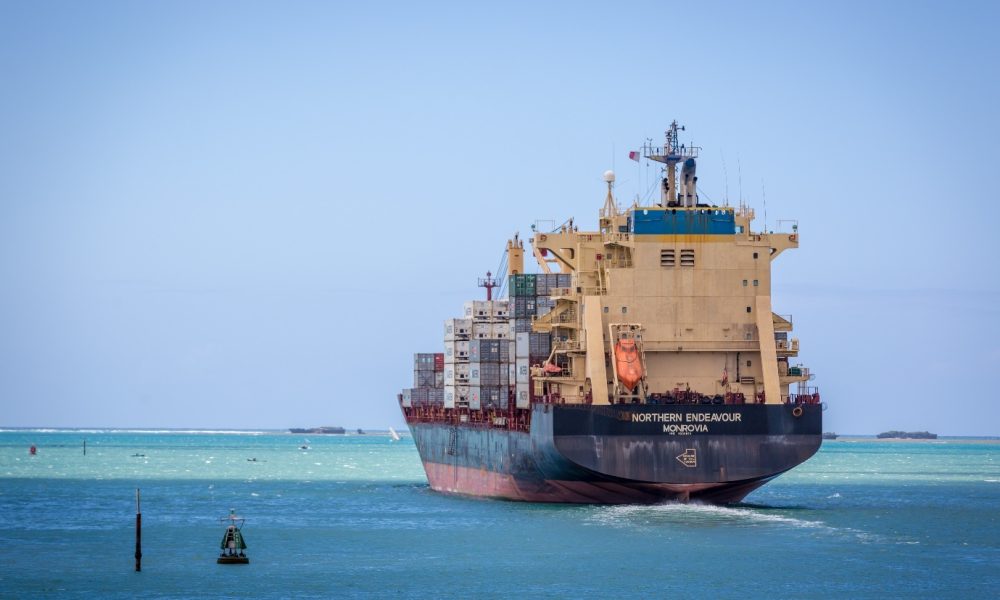 Container ship leaving an Indian Ocean port, a route for Tanzanian trade and investment
