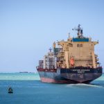 Container ship leaving an Indian Ocean port, a route for Tanzanian trade and investment